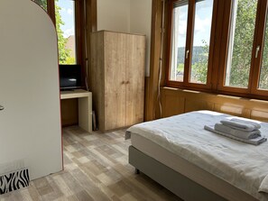 1 bedroom, desk, iron/ironing board, travel cot