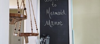 The cozy Mermaid Manor is located close to area beaches and all area attractions