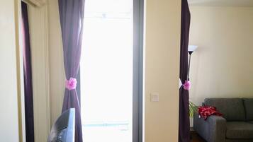 Apartment, 1 Bedroom, Balcony, Garden View | Living area