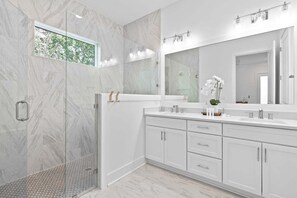 Shower, hair dryer, towels, toilet paper
