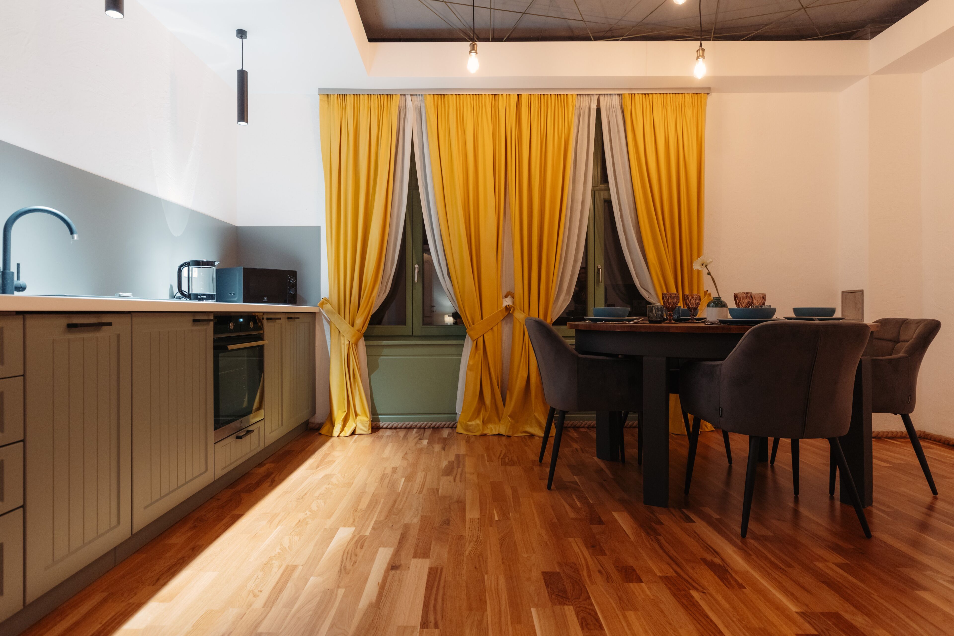 A modern kitchen with a dining area.