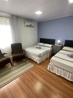 Deluxe Suite, 2 Double Beds | 1 bedroom, iron/ironing board, free WiFi