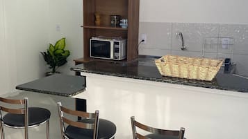 Deluxe Suite, 2 Double Beds | Private kitchen | Fridge, microwave, cookware/dishes/utensils, spices