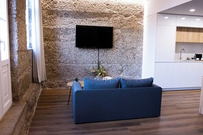 City Loft | Living area | 20-inch flat-screen TV with cable channels