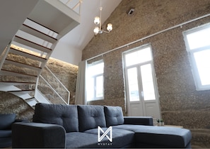 City Loft | Living area | 20-inch flat-screen TV with cable channels