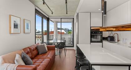 Camillea - One-bedroom fifth-floor residence with MCG and city views.