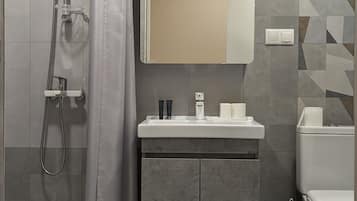Economy Room, 2 Single Beds, Non Smoking, City View | Bathroom | Shower, hydromassage showerhead, hair dryer, slippers