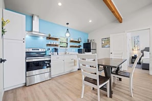 Fridge, microwave, coffee/tea maker, cookware/dishes/utensils