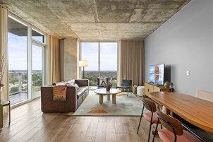 Luxury Condo, 1 King Bed with Sofa bed, Balcony, City View | Living area | LED TV, Netflix, books, streaming services