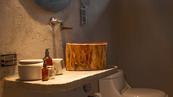 Separate bathtub and shower, towels, soap, shampoo