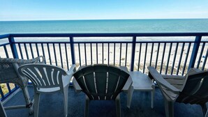 A balcony with a view of the beach and ocean. - Atlantica Resort Condo🍹Oceanfront (Myrtle Beach)