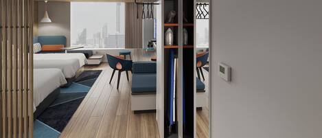 A modern hotel room with a bed, seating area, and a view of the city skyline.