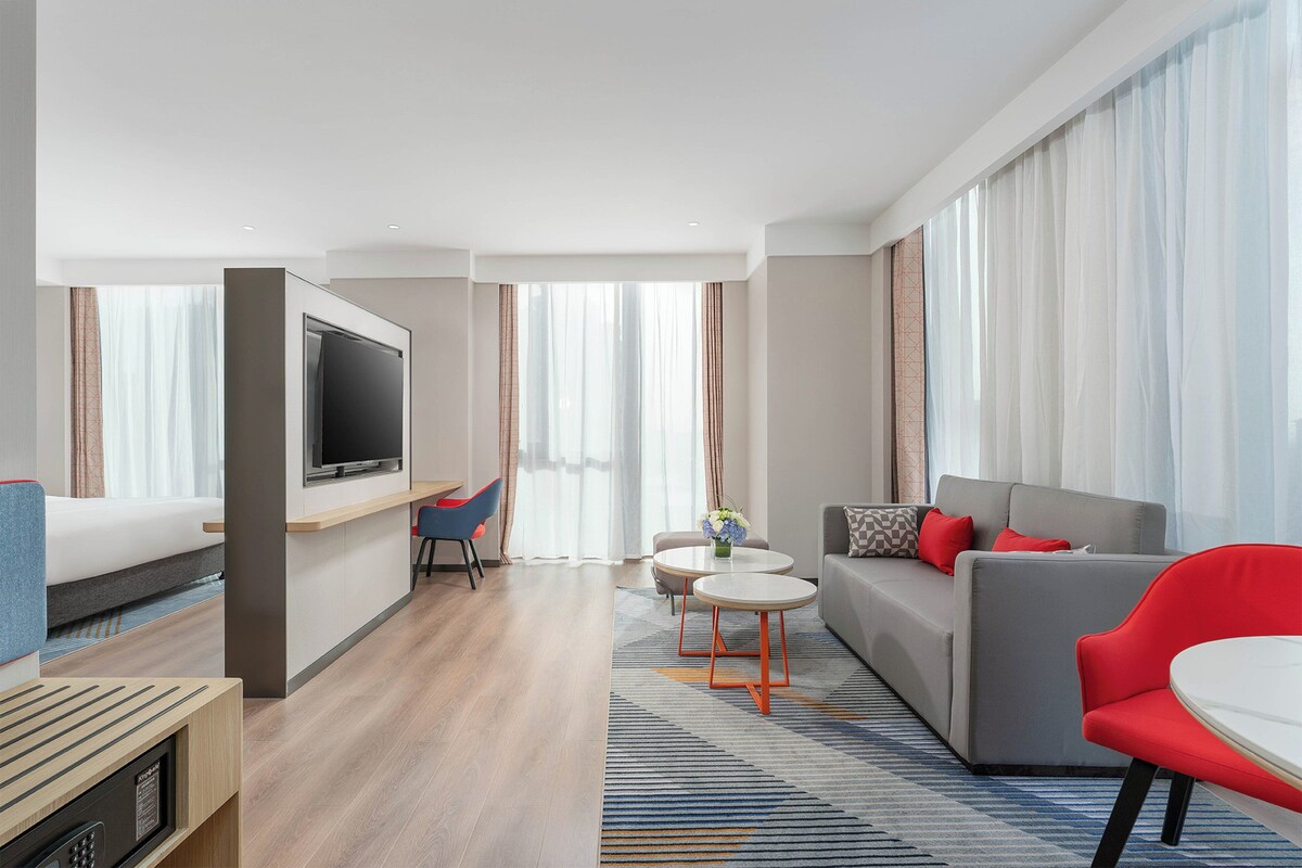 Premium bedding, down duvets, laptop workspace, blackout curtains