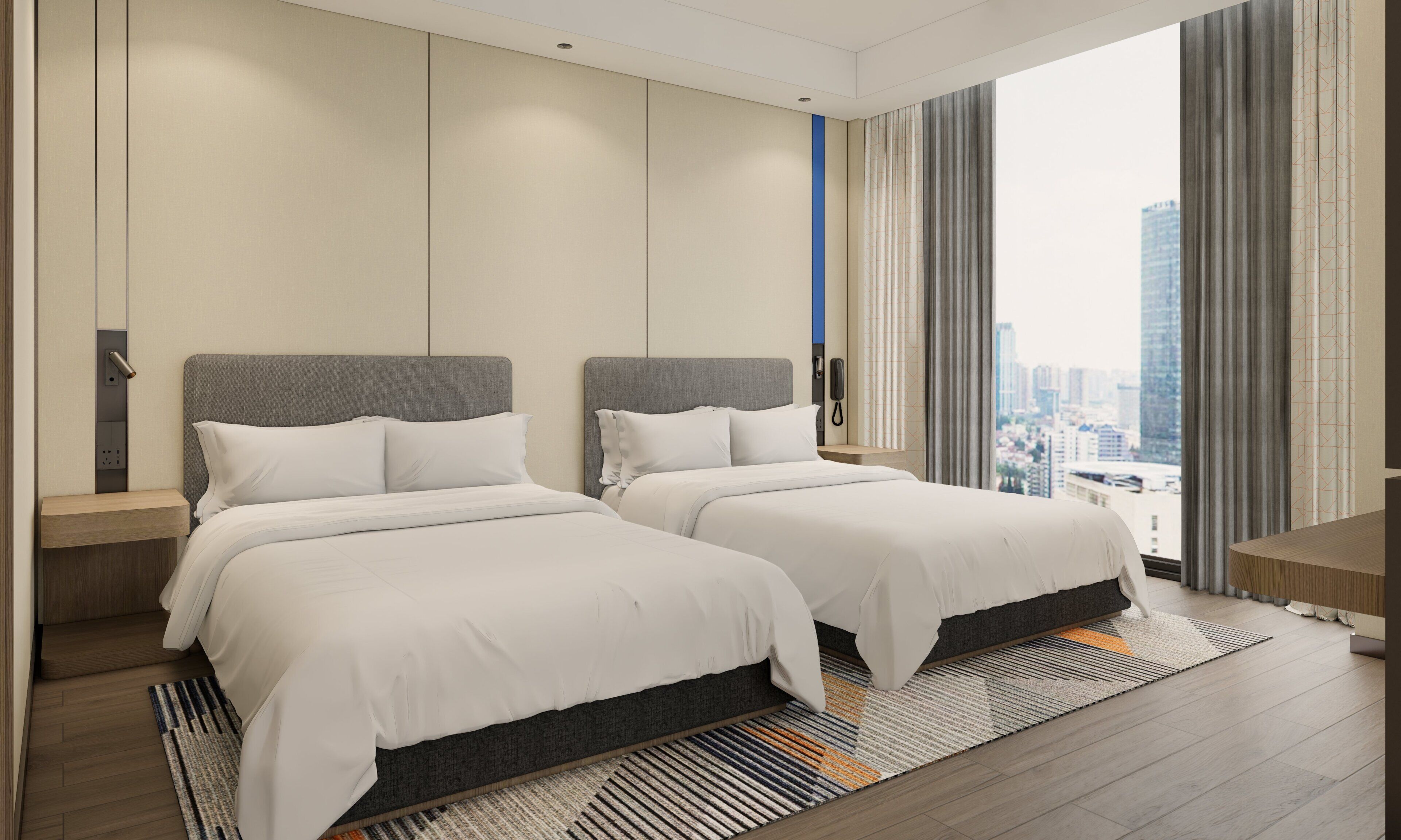 A hotel room with two beds, a city view, a phone on the wall, and a wooden floor.