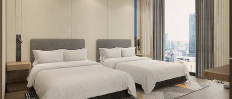 A hotel room with two beds, a city view, a phone on the wall, and a wooden floor.