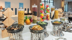 A buffet with various food options and condiments in clear containers. - Holiday Inn Express Xi An Daxing by IHG (Xi'an)