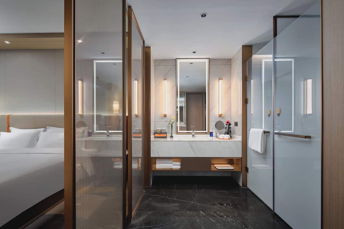 Separate bathtub and shower, rainfall showerhead, hair dryer, bathrobes