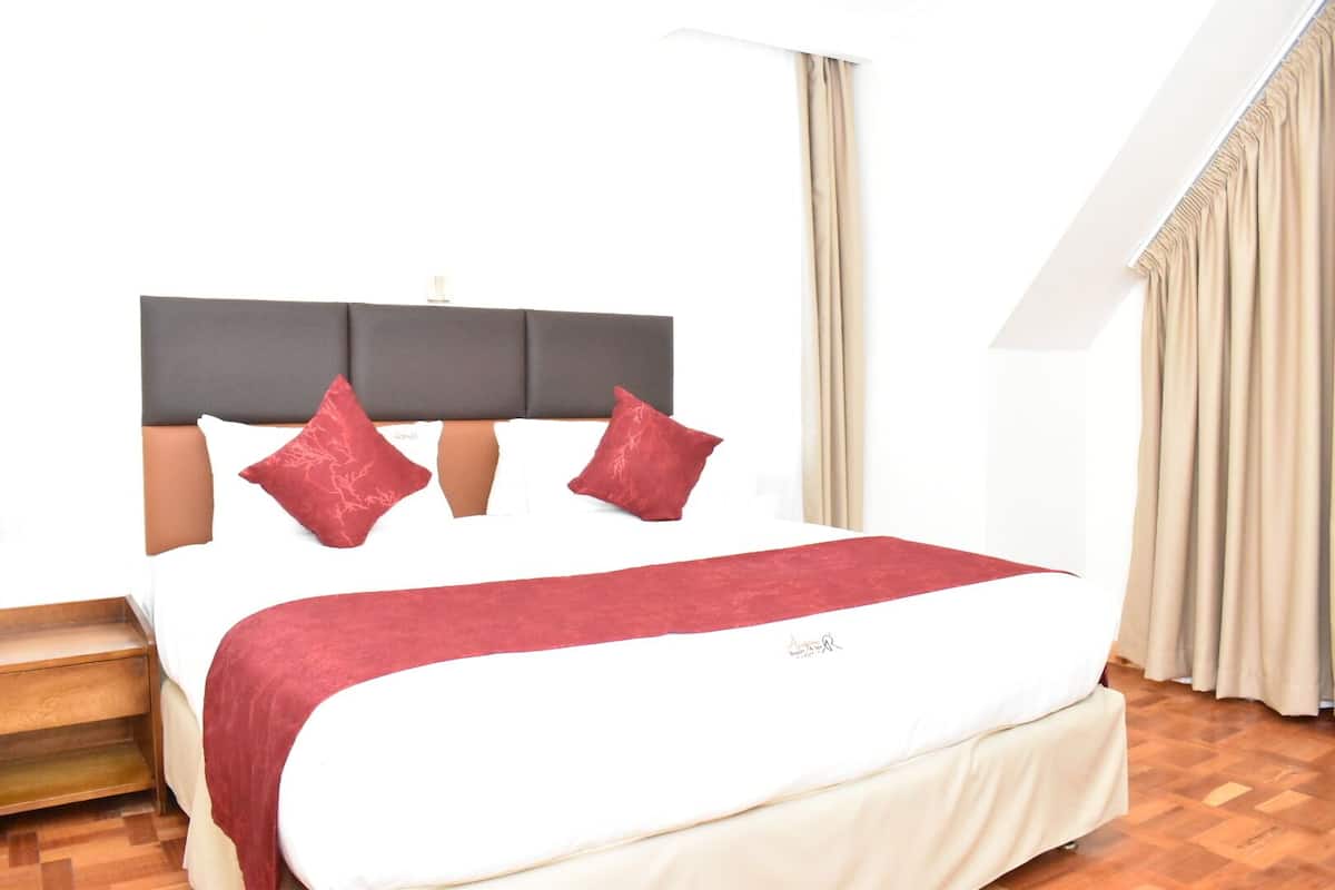 Deluxe Room | 1 bedroom, in-room safe, individually decorated, individually furnished
