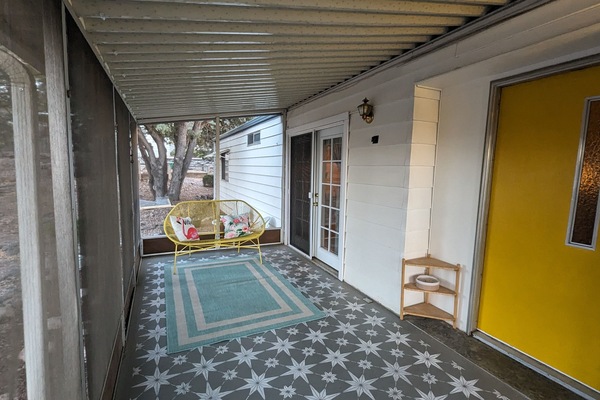 Enjoy a quiet morning on the charming retro screened porch