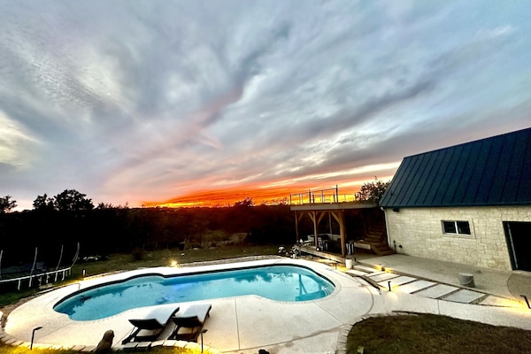 Gorgeous greenbelt view with pool and rooftop deck