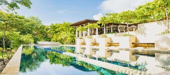 This luxury home features a private pool and stunning ocean views
