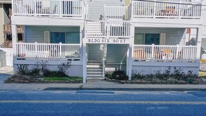 A multi-story building with balconies, labeled "SEAWOOD" and "BLDG SIX 90 ST".