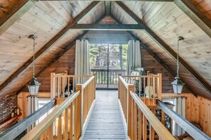 A wooden staircase leading to a balcony with a view of a house. - Charming Tamworth Cabin w/ Grill & Fireplace (Tamworth)