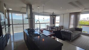 Deluxe Apartment, Beach View | Living area | 45-inch Smart TV with digital channels, Netflix, pay films