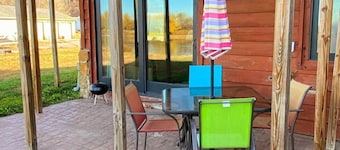 Waterfront Sunset Cabin w/ Patio & Firepit- 2 bdrm