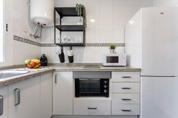 Fridge, microwave, stovetop, coffee/tea maker