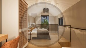 A modern bedroom with a bed, a nightstand, a lamp, and a view of the outdoors. - Ferienhauspark Hasselfelde (Oberharz am Brocken)