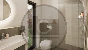 A modern bathroom with a toilet, sink, and shower. - Ferienhauspark Hasselfelde (Oberharz am Brocken)