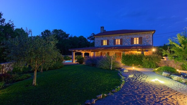 A stone house with a tiled roof, a paved driveway, and a well-maintained lawn. - Villa Mediterana (Kvarner - Kras) (Kras)