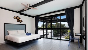 A modern bedroom with a bed, a ceiling fan, a large window with curtains, and a view of the outside. - Innovative 12m Eco Pool Villa Sunset 1 (Rawai)