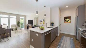 Fridge, microwave, coffee/tea maker, cookware/dishes/utensils