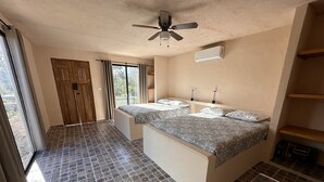 A bedroom with two beds, a ceiling fan, a window with curtains, and a tiled floor. - xbalche eco hotel & RV park (Acanceh)