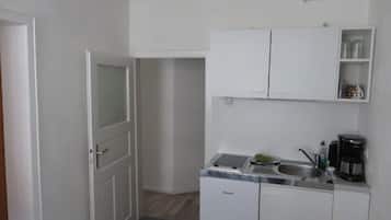 Fridge, stovetop, electric kettle, cookware/dishes/utensils