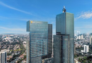 Two high-rise buildings with Pan Pacific signage, surrounded by a cityscape. - Pan Pacific Jakarta (Jakarta)