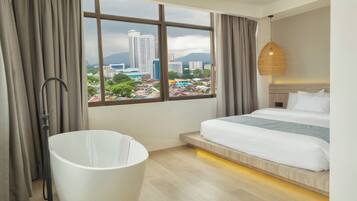 Junior Suite | 1 bedroom, in-room safe, desk, blackout curtains