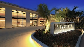 A modern building with large windows and a sign that reads "VIVOVIVA SHICAKUJIWA". - VIVOVIVA ISHIGAKIJIMA (Ishigaki)