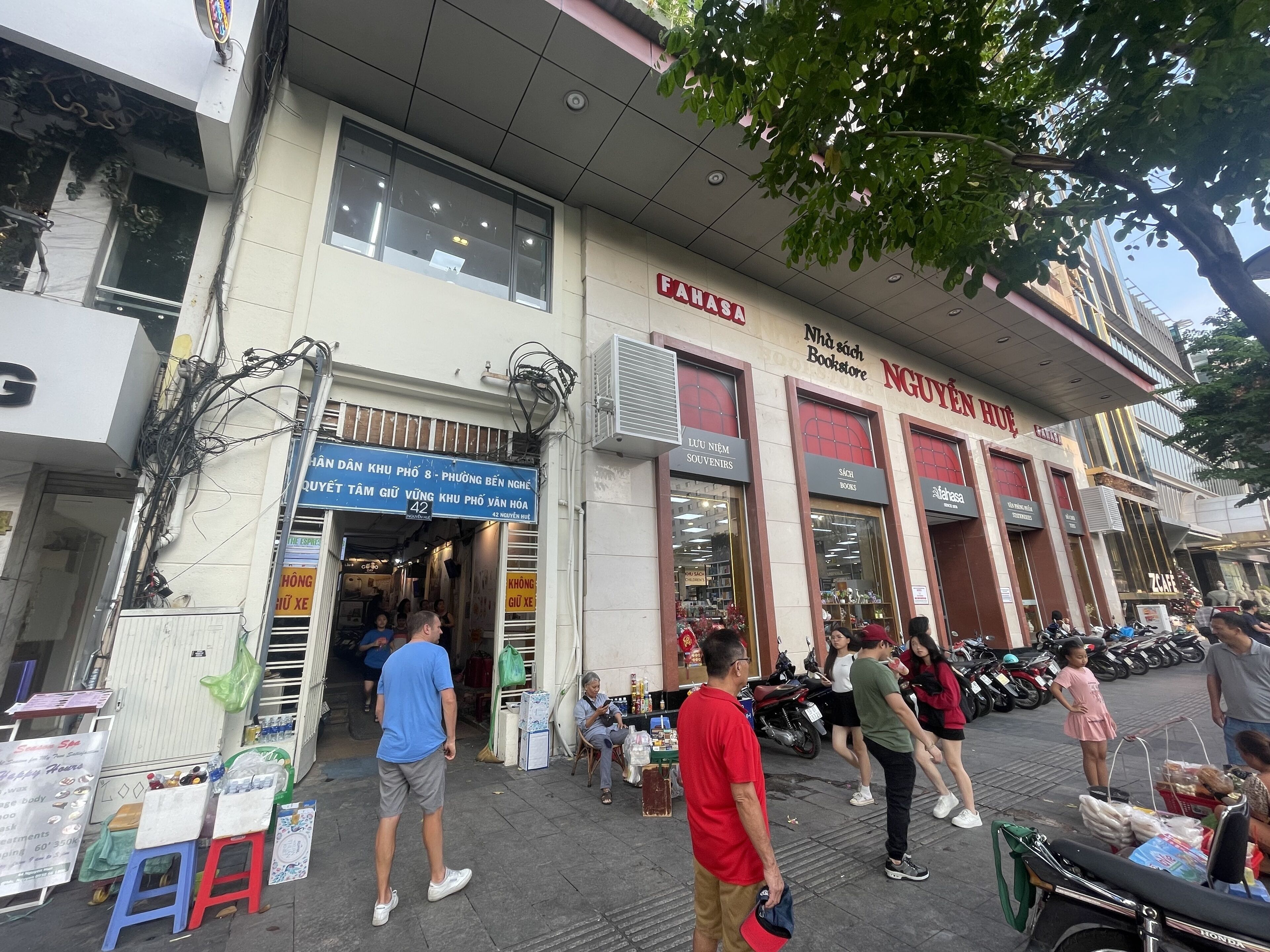 A street view with a bookstore and a cafe.