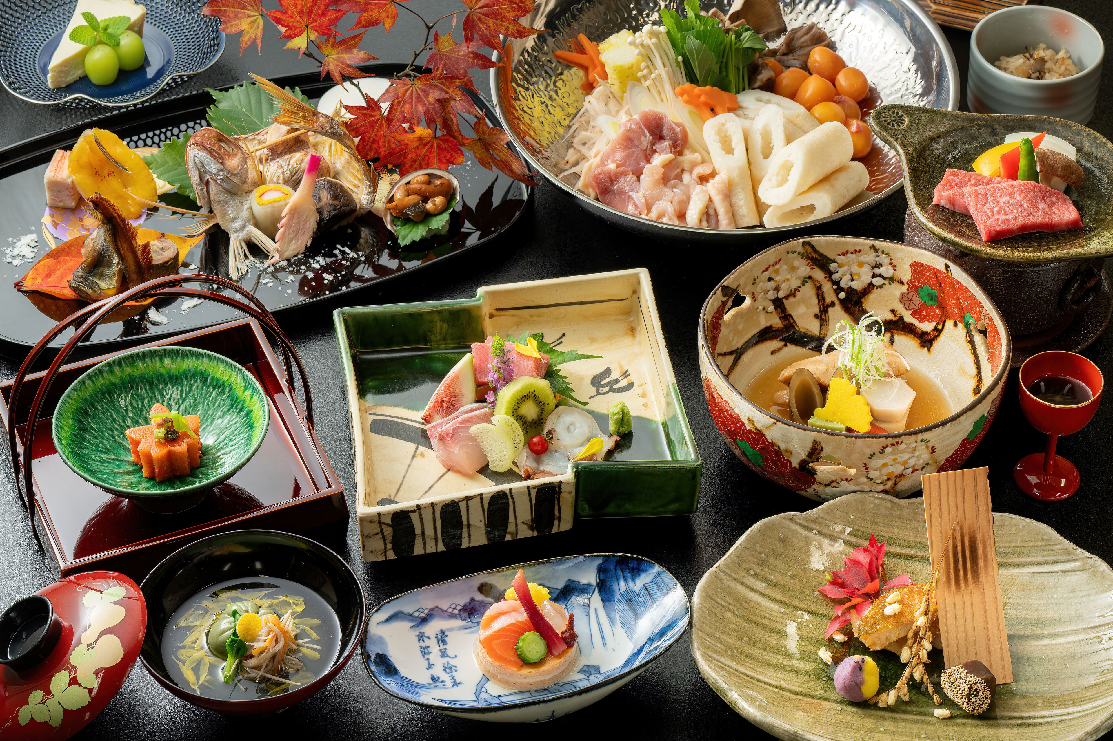 A variety of traditional Japanese dishes arranged on a table.