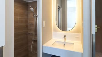 Shower, hair dryer, slippers, towels