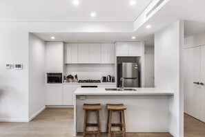 Fridge, microwave, oven, stovetop - First Floor 3-Bed Stunning Unit by The Ocean (Kiama)