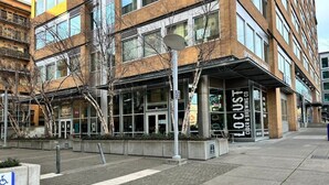 A building with a storefront labeled "LOCAST CIDER & BREWING CO." - #StayInMyDistrict Downtown Loft2 (Vancouver)