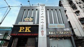 A building with signs for 'P.K Family Restaurant & Bar' and 'Taj Palace'. - Taj Palace (Mumbai)