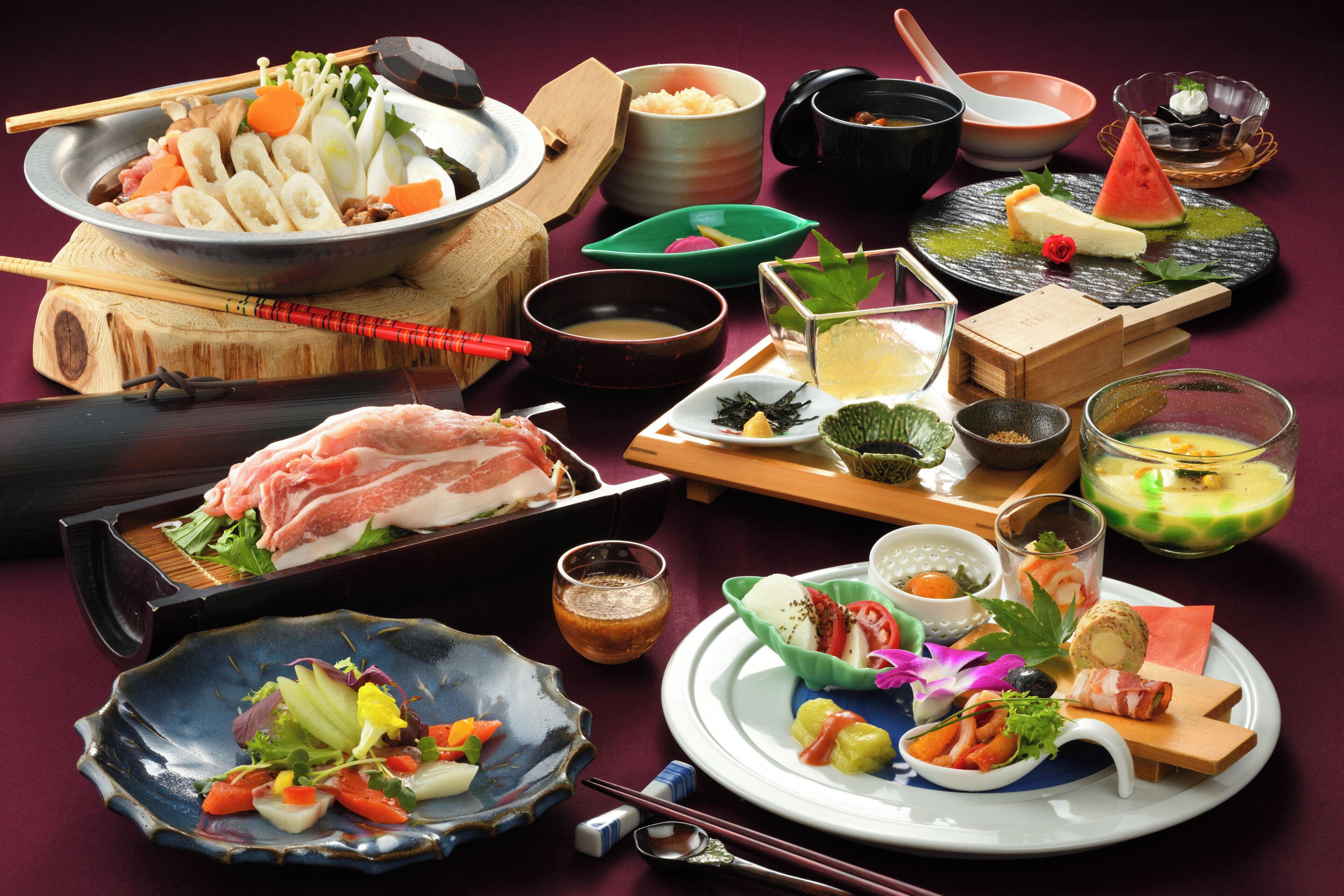 A variety of dishes and utensils on a table, suggesting a dining setup.