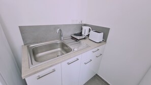 Fridge, microwave, electric kettle, toaster