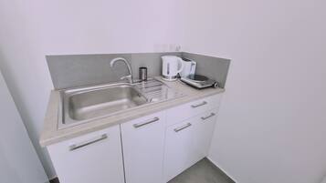 Fridge, microwave, electric kettle, toaster