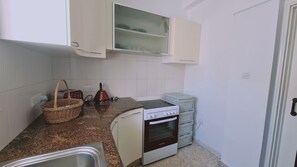 Fridge, oven, electric kettle, toaster
